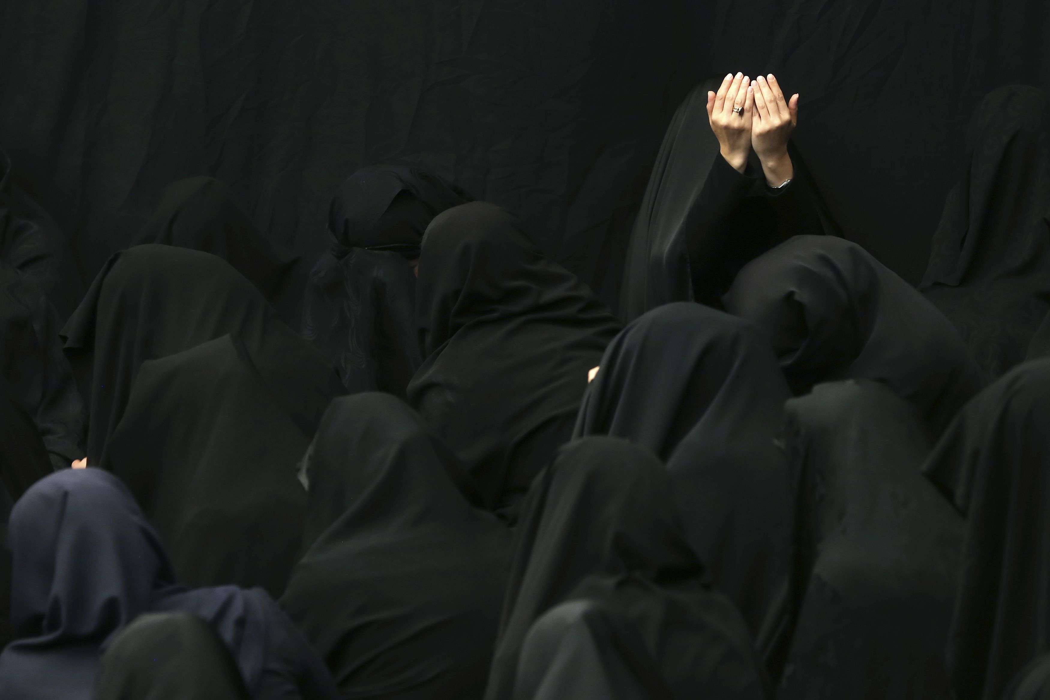 Iranian Shiite Muslim women mourn during a ceremony at Sadat Akhavi Mosque in Tehran, Iran, Sunday, Oct. 9, 2016, three days prior to the death anniversary of 7th century Shiite Imam Hussein, the grandson of Prophet Muhammad, who was killed in a battle in Karbala in present-day Iraq. (AP Photo/Ebrahim Noroozi)