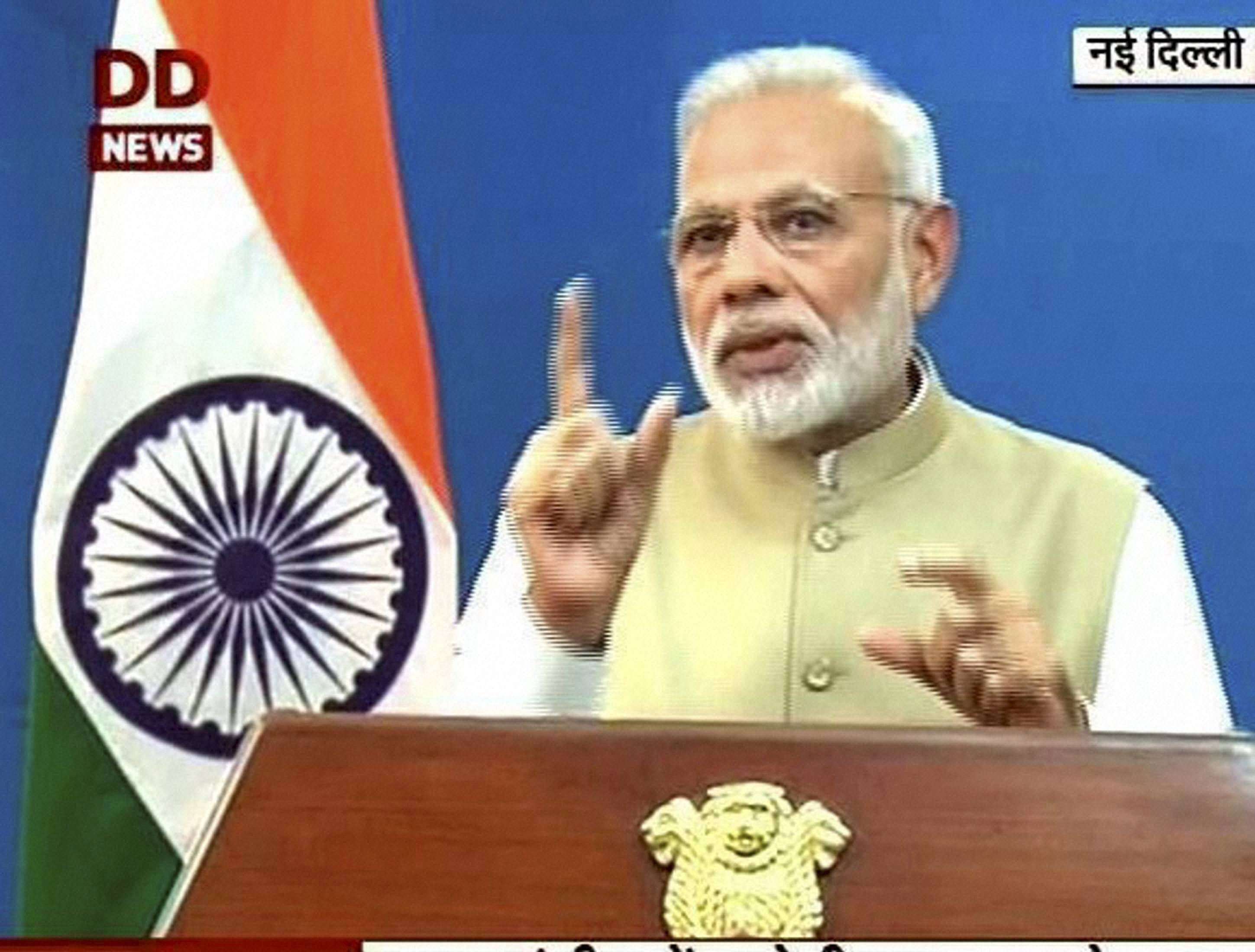 New Delhi: TV Grab- Prime Minister Narendra Modi gestures as he addresses to the nation in New Delhi on Tuesday. PTI Photo/ Courtesy DD(PTI11_8_2016_000314A)