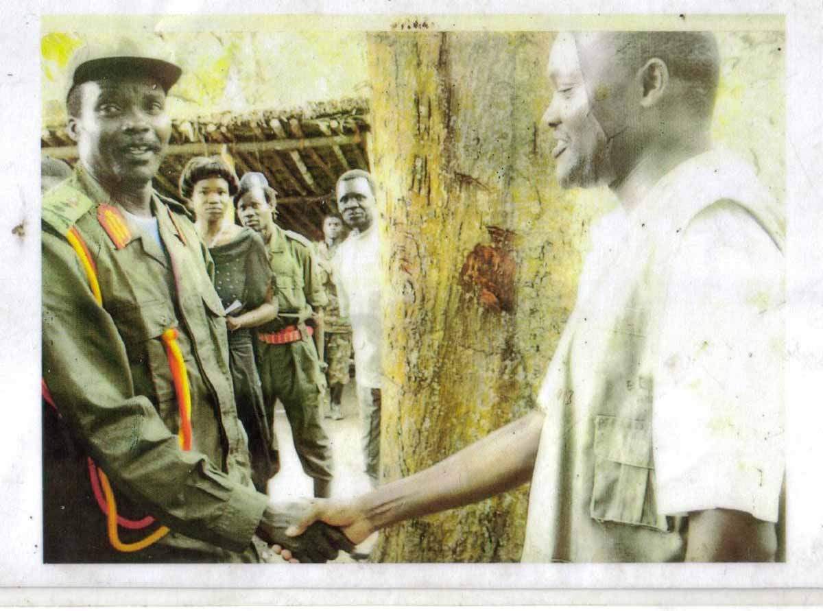The author (r) shakes hands with Kony during their meeting. (Photo courtesy of Grace Matsiko)