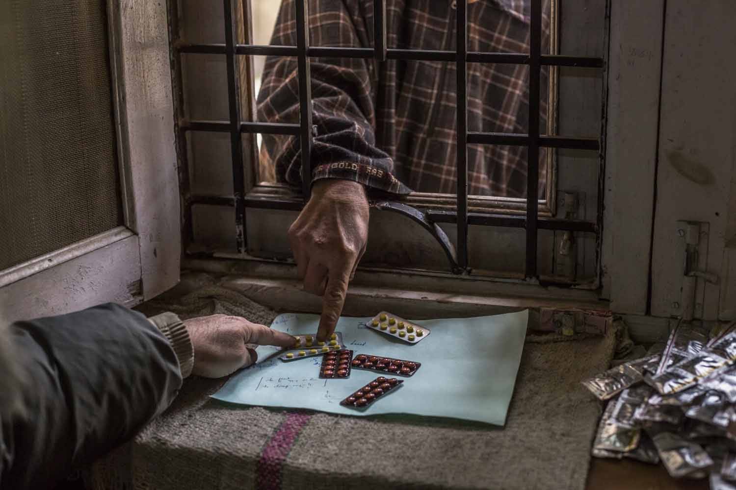 Collecting prescription anti-depression drugs at a dispensary in Srinagar. December, 2015. (AFP / Rebecca Conway) 