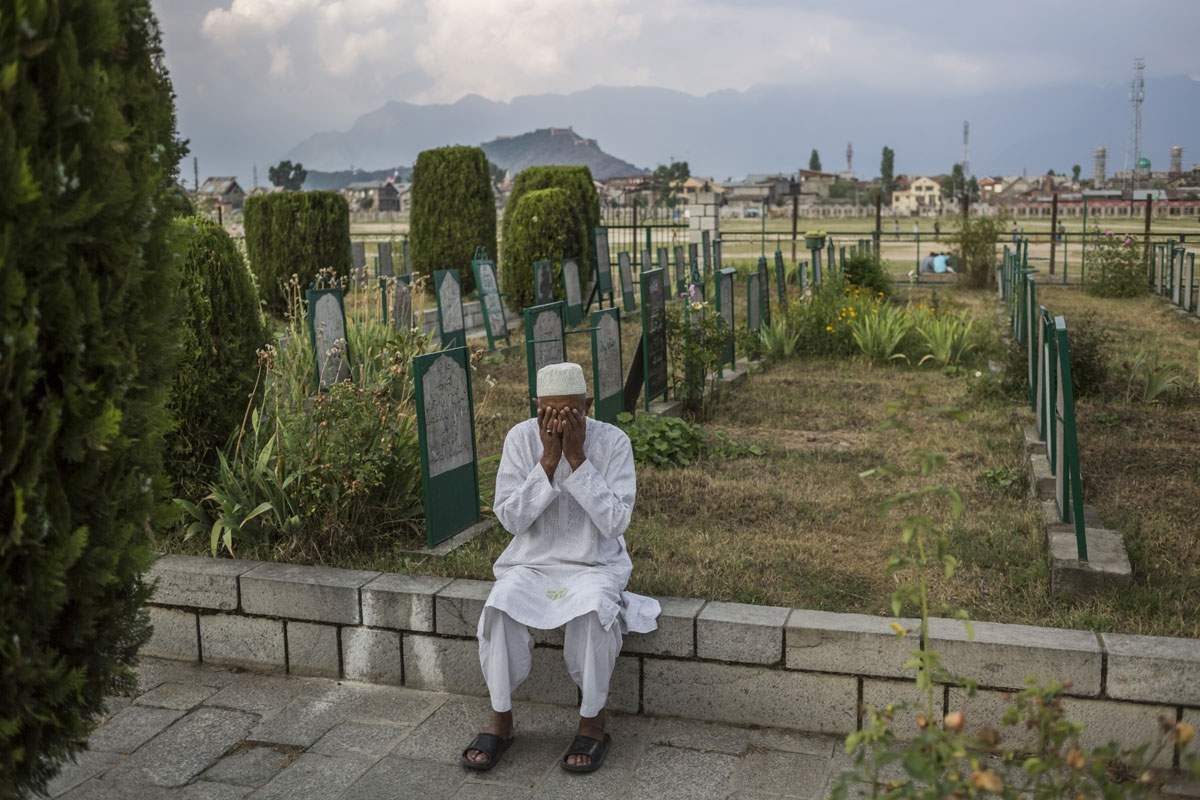 Praying at a cemetery in Srinagar. June, 2016. (AFP / Rebecca Conway)