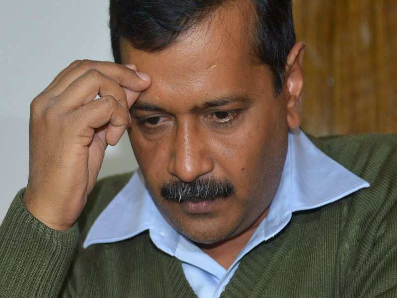 Indian leader of the Aam Aadmi Party (AAP) and Chief Minister of Delhi, Arvind Kejriwal listens during a press conference in Amritsar on December 30, 2016. / AFP PHOTO / Narinder NANU