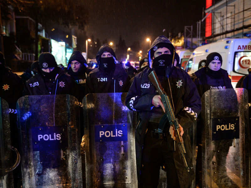 Turkish police officers block the road leading to the scene of an attack in Istanbul
