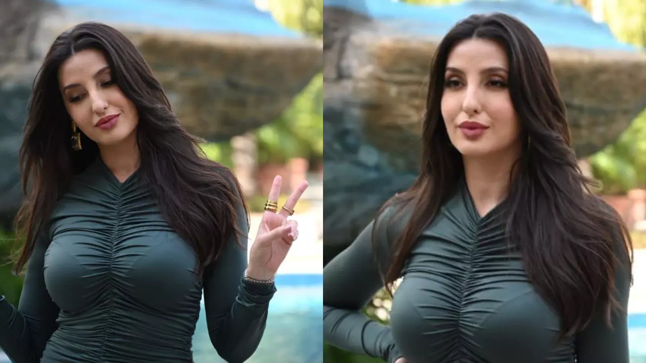 1707741197_nora-fatehi-in-dark-green-ruched-bodycon-dress-and-makeup