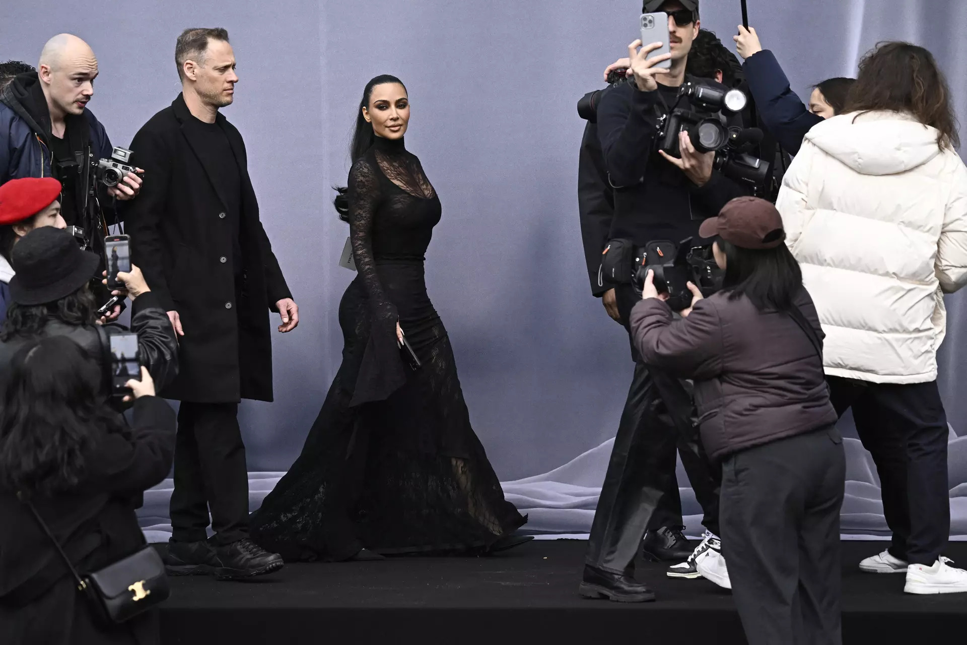 US socialite Kim Kardashian (C) arrives for the presentation of creations by Balenciaga for the Women Ready-to-wear Fall-Winter 2024/2025 collection as part of the Paris Fashion Week, in Paris on March 3, 2024.