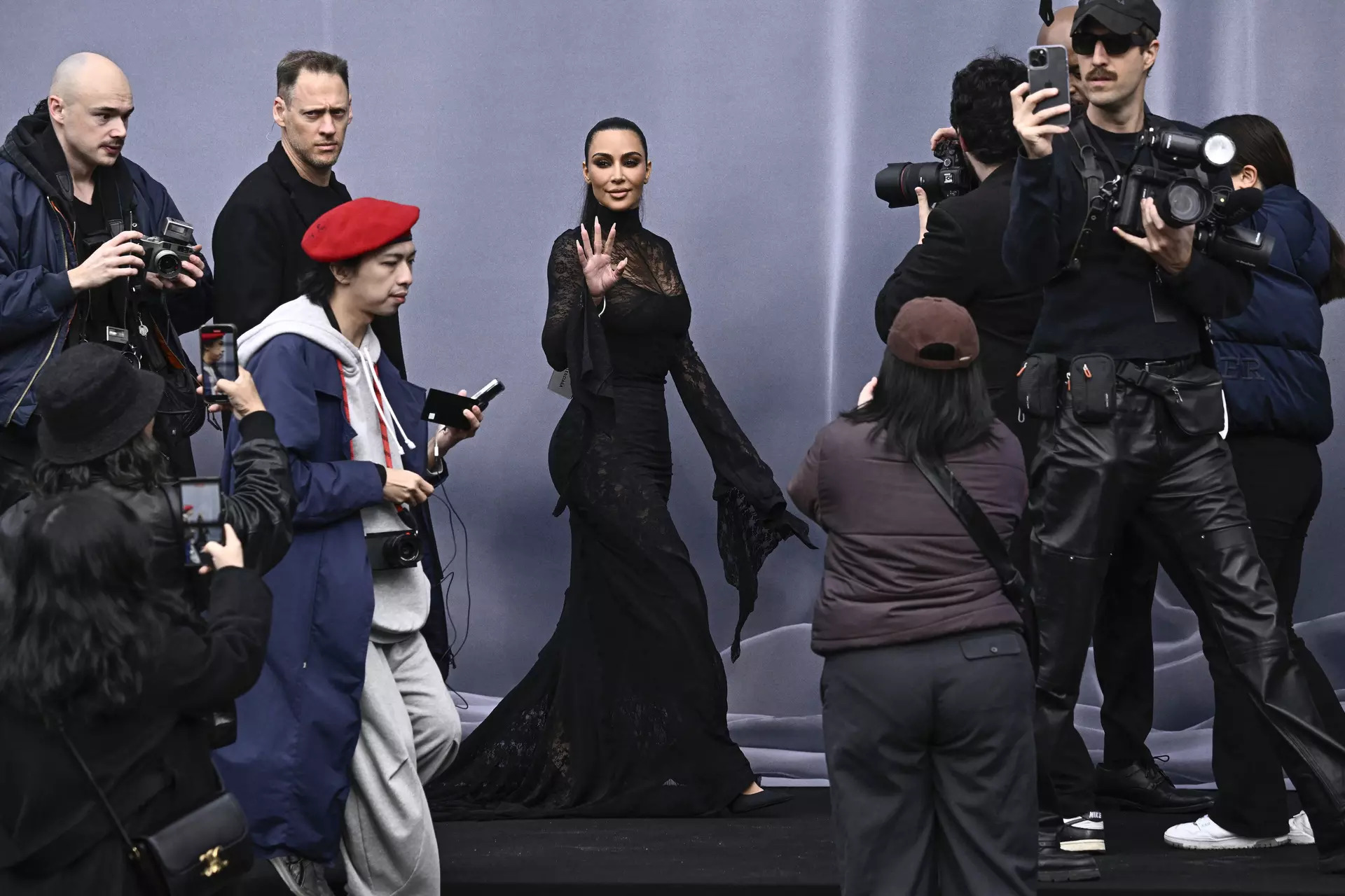 US socialite Kim Kardashian (C) arrives for the presentation of creations by Balenciaga for the Women Ready-to-wear Fall-Winter 2024/2025 collection as part of the Paris Fashion Week, in Paris on March 3, 2024.