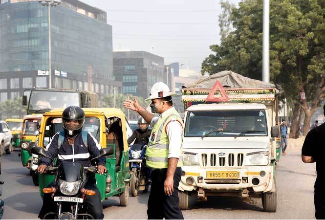 Gurgaon cops say that the city’s deteriorating air quality has resulted in several of them developing ailments, including cough, breathing issues and blurry vision Gurgaon--Traffic-police--air-pollution-AKG_3063