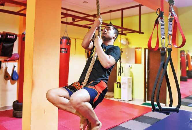 The climbing-rope move is a part of CrossFit workout NT-CrossFit-RAN_6357