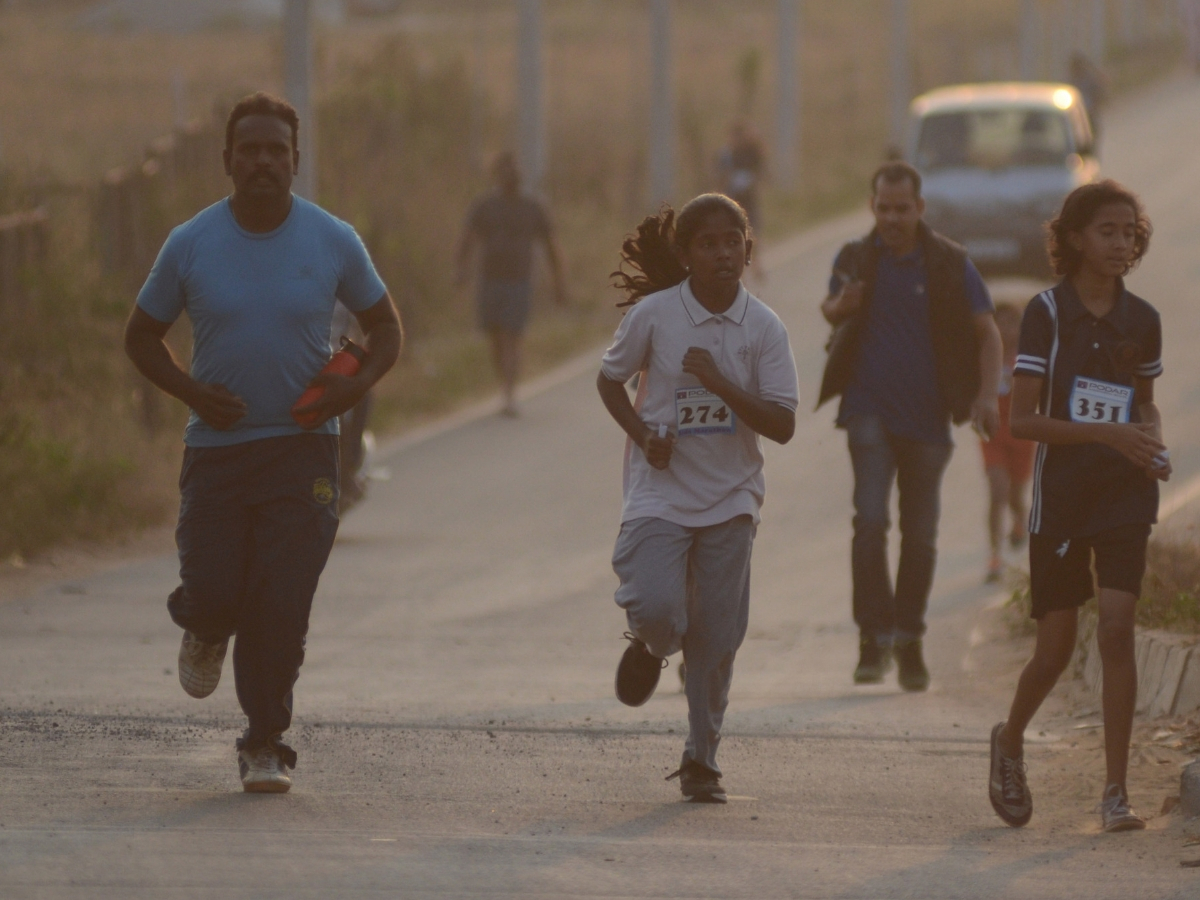 Children ran on the main road early in the morning . Photo by Anantha Subramanyam K/MMCL