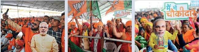 Youth take selfie with Modi’s cutout in Himmatnagar; women supporters, who were present in huge numbers, display ‘Main Bhi Chowkidar’ placards and Modi masks Youth take selfie with Modi’s cutout in Himmatnagar; women supporters, who were present in huge numbers, display ‘Main Bhi Chowkidar’ placards and Modi masks