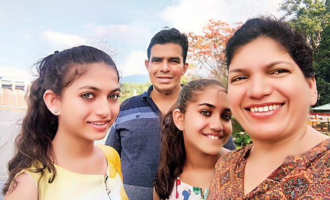 William Fernandes with his family