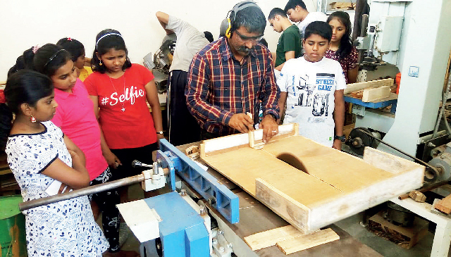 Artist Sanjay Yamgar teaching kids carpentry