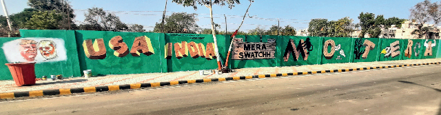 NGO volunteers have been painting the wall with messages NGO volunteers have been painting the wall with messages