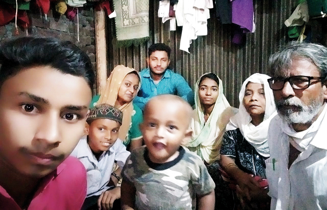 Malvani resident Jamil Shaikh (in white shirt) with his family