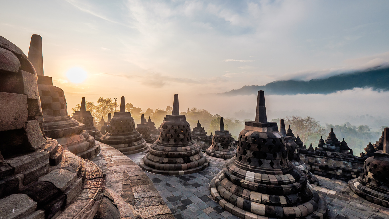 Borobudur temple, a 9th century Buddhist temple with terraces and stupa  with latticed exterior, bell Stock Photo by Mint_Images