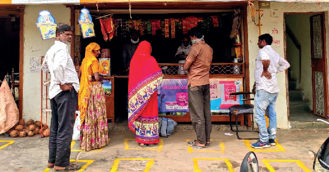Squares drawn outside shops to ensure social distancing among customers