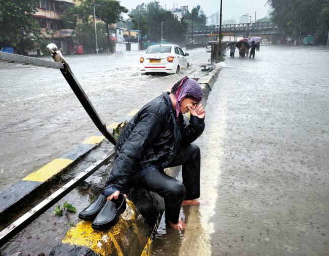 Ashok Singh, 45, a Bhendi Bazaar vegetable vendor, who opened his shop for the first time in four months on Wednesday but was forced to shut it because of flooding, burst into tears at King Circle as he walked back to his house in Kurla