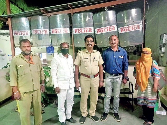 Gaikwad (far left) took the bus to Lonikand police station after the incident