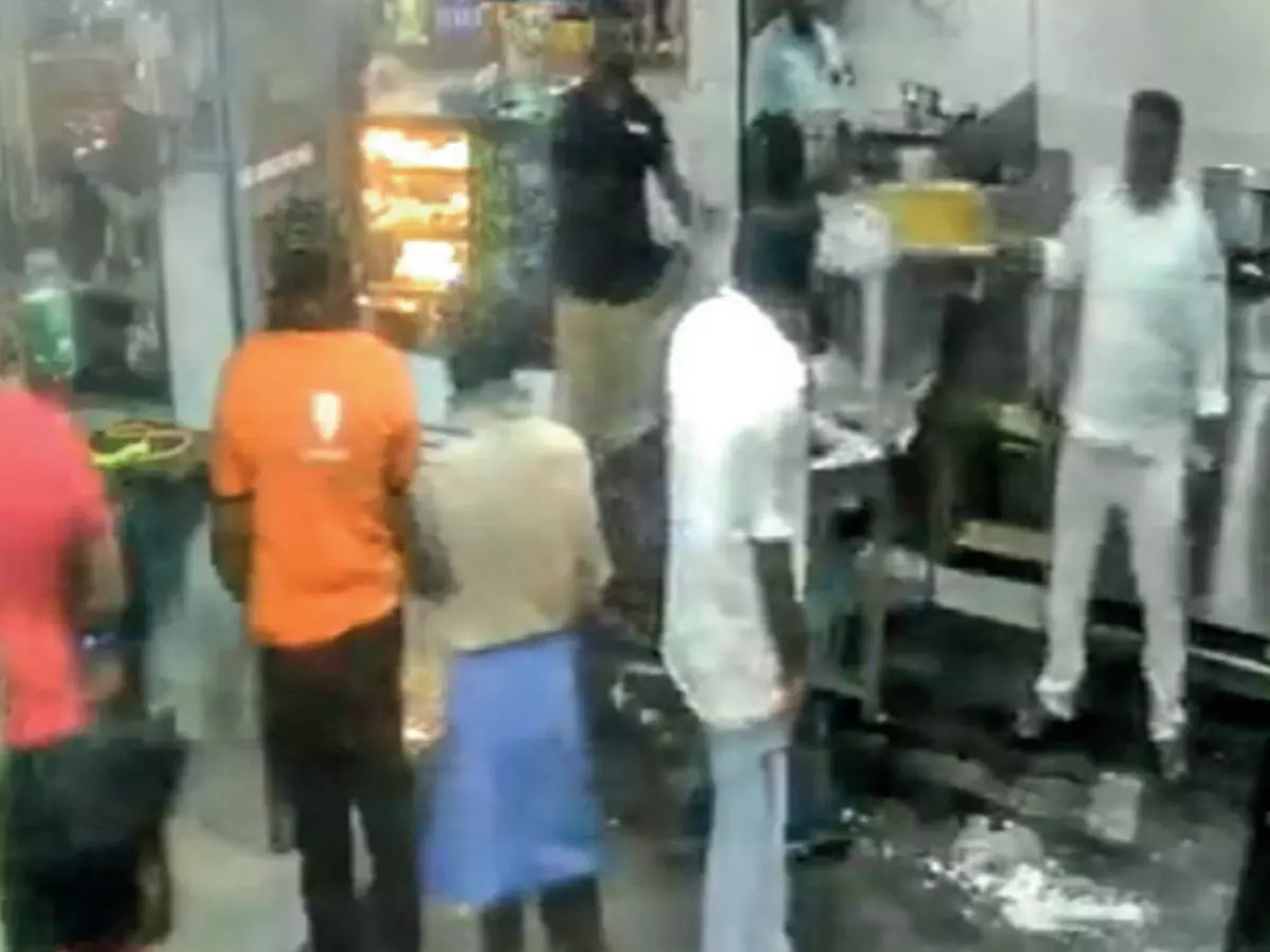 Out of control: A CCTV camera grab shows some men damaging an eatery at Thiruneermalai
