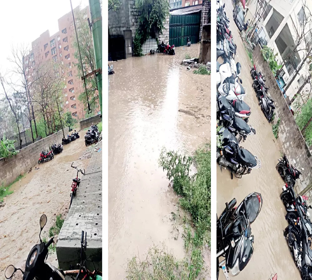 Spot the difference: Is it a road? Is it a river? Vehicles are balanced precariously in the lanes; residents say they have been left to fend for themselves
