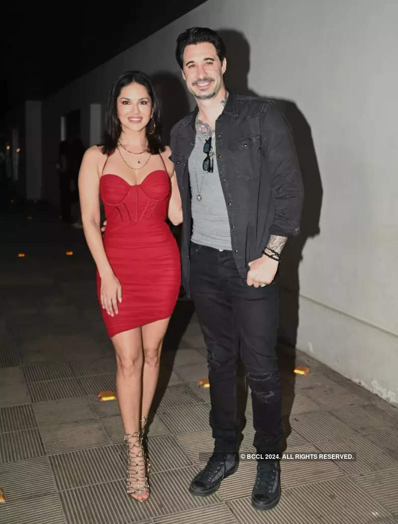 Sunny Leone makes heads turn in a red dress, celebrates birthday with the paps