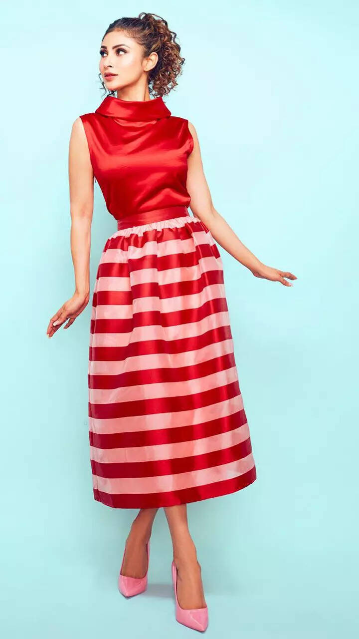Mouni Roy exudes Barbie vibes in a striped midi skirt and red top