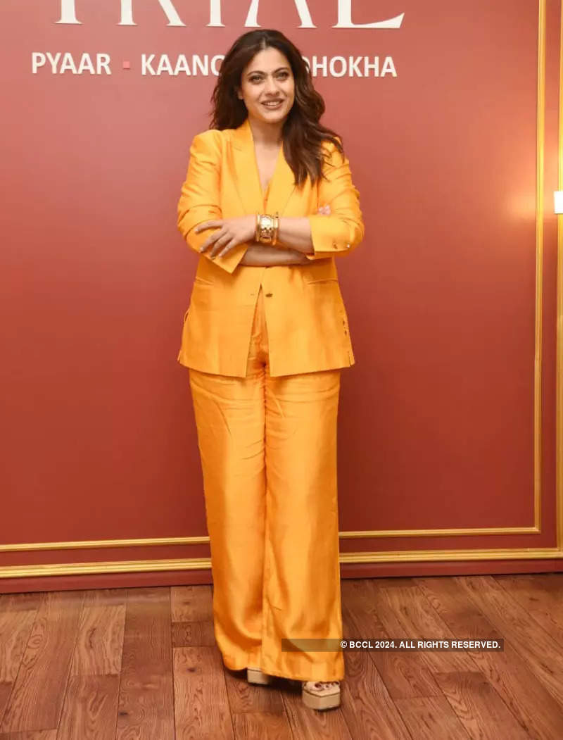 Kajol exudes boss lady vibes in an orange pantsuit at the promotion of The Trial