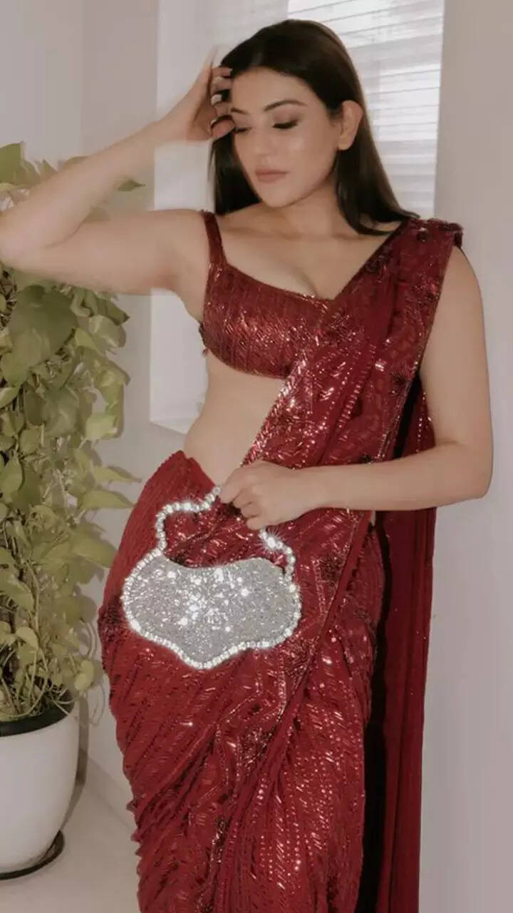 Kajal Aggarwal paints the town red in dazzling saree and flower-shaped statement purse