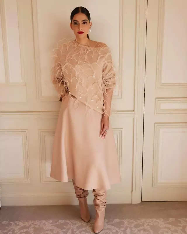 Sonam Kapoor looks classy in an off-shoulder cardigan, midi skirt and stunning boots, see pictures