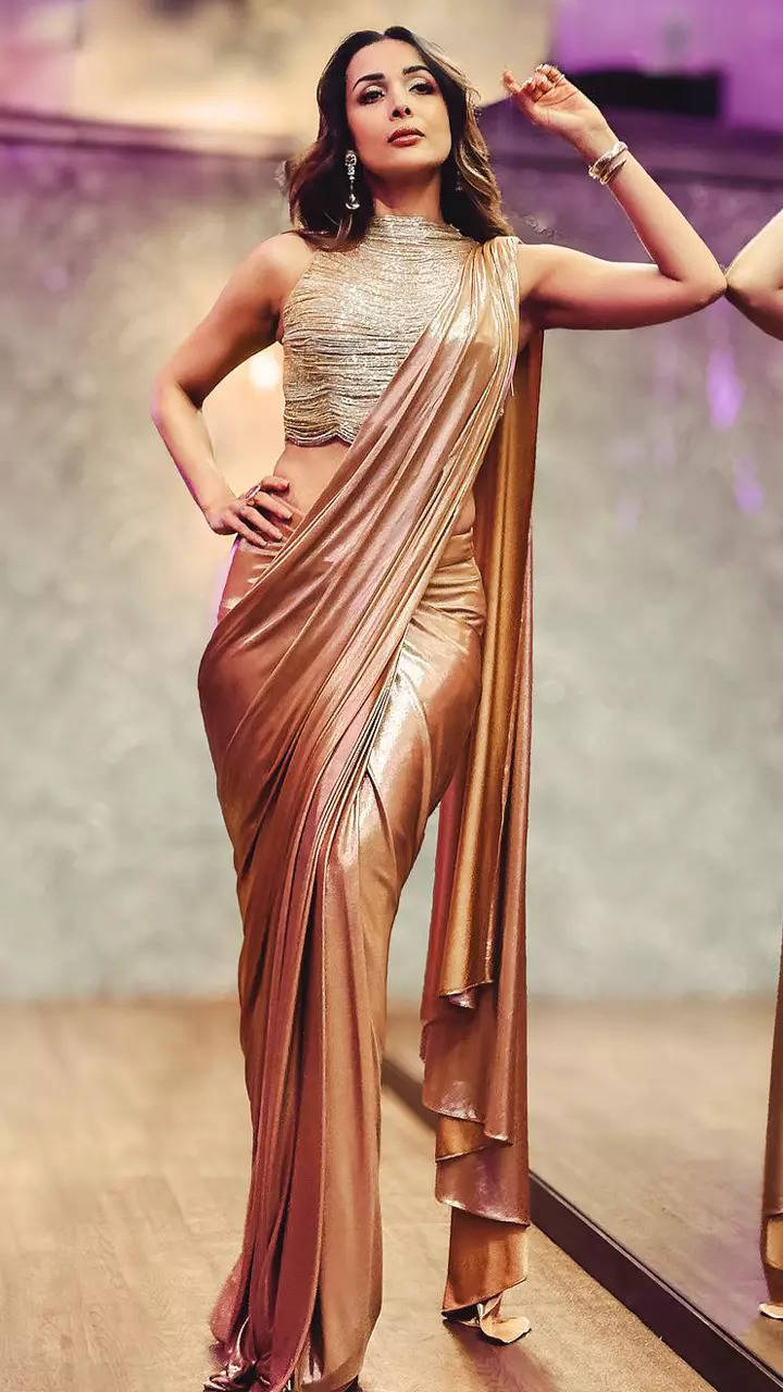 Malaika Arora captivates hearts with her look in a liquid gold saree and  tasseled blouse | Times of India