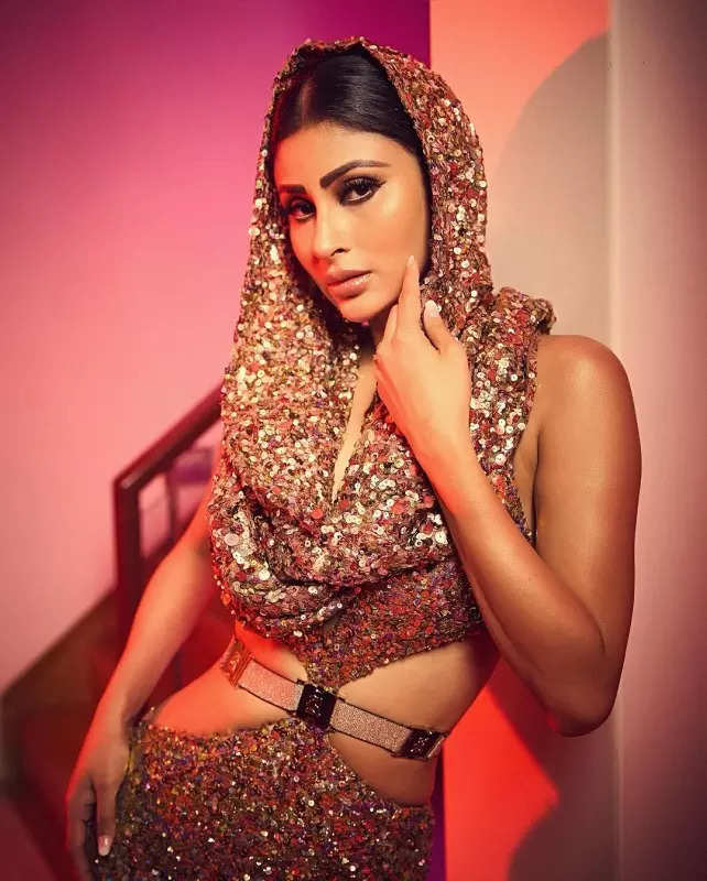 Mouni Roy's penchant for shimmery golden ensembles in stunning pictures