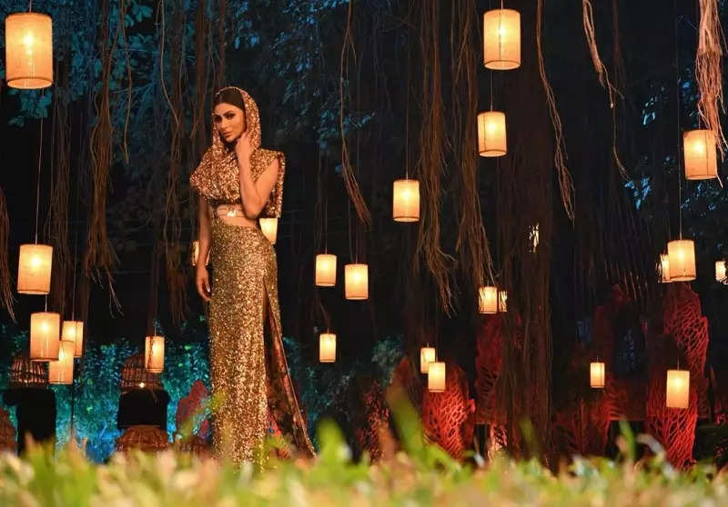 Mouni Roy's penchant for shimmery golden ensembles in stunning pictures