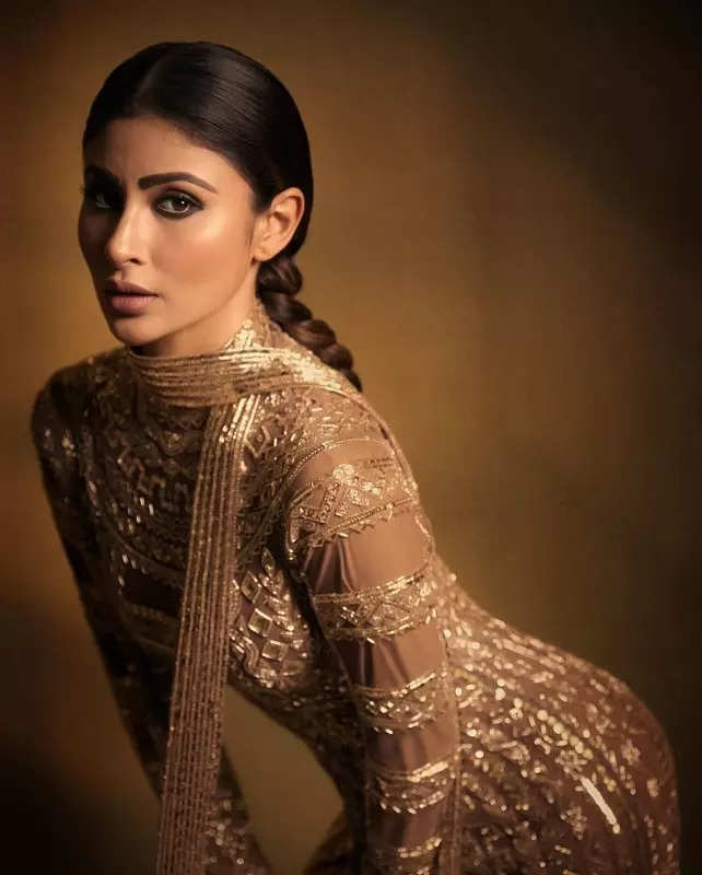 Mouni Roy's penchant for shimmery golden ensembles in stunning pictures