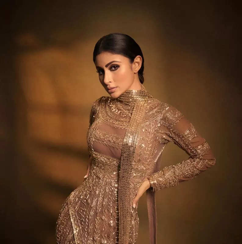 Mouni Roy's penchant for shimmery golden ensembles in stunning pictures