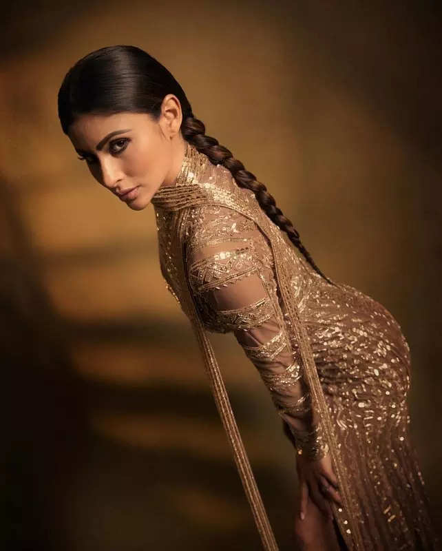 Mouni Roy's penchant for shimmery golden ensembles in stunning pictures