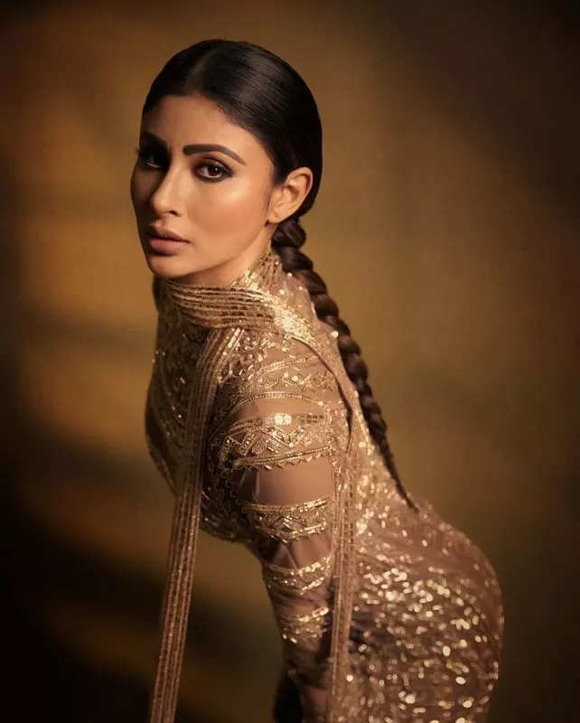 Mouni Roy's penchant for shimmery golden ensembles in stunning pictures