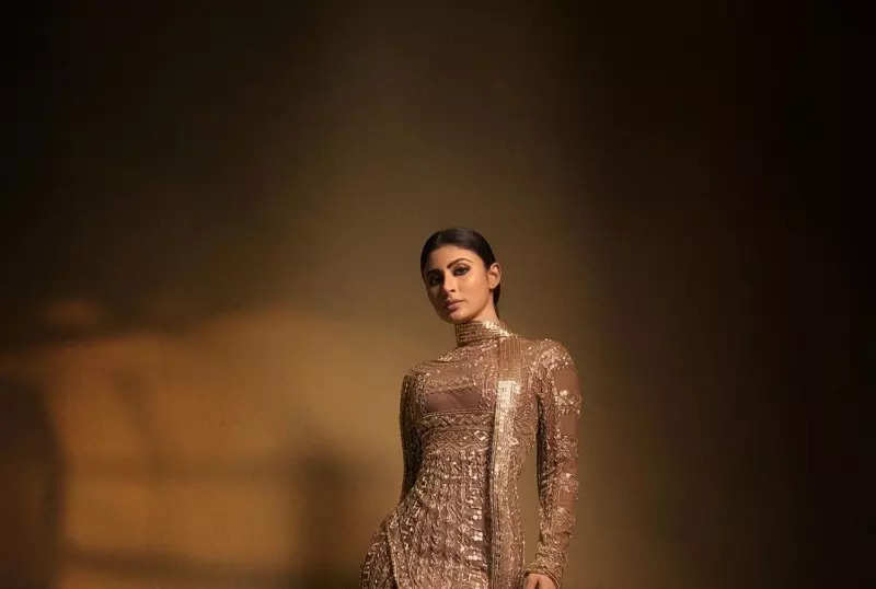 Mouni Roy's penchant for shimmery golden ensembles in stunning pictures