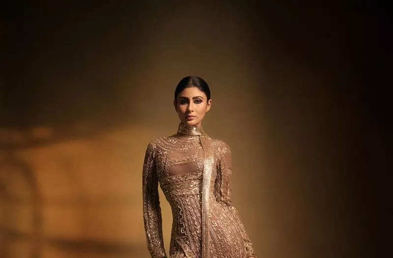 Mouni Roy's penchant for shimmery golden ensembles in stunning pictures