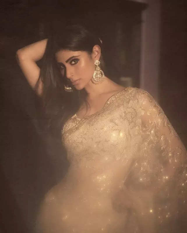 Mouni Roy's penchant for shimmery golden ensembles in stunning pictures