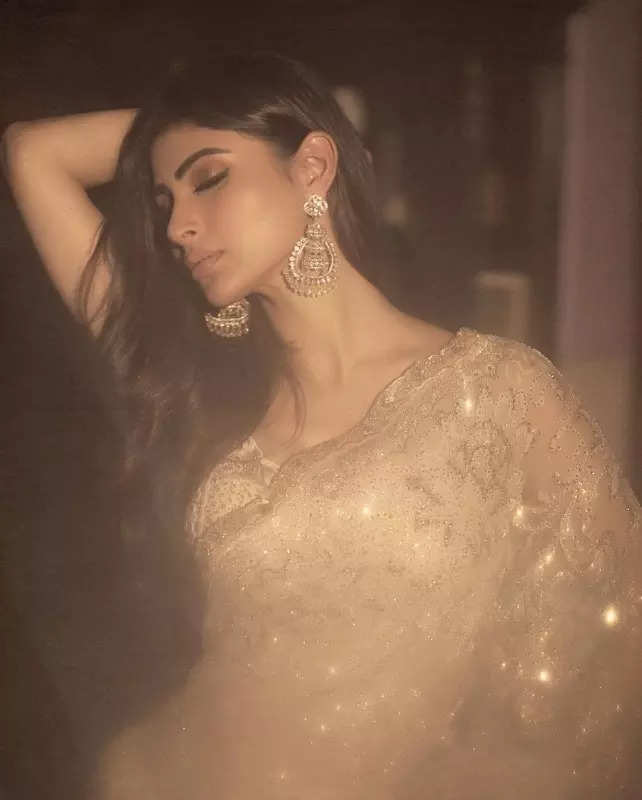 Mouni Roy's penchant for shimmery golden ensembles in stunning pictures