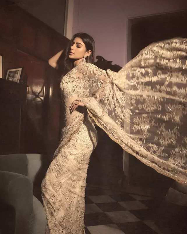 Mouni Roy's penchant for shimmery golden ensembles in stunning pictures