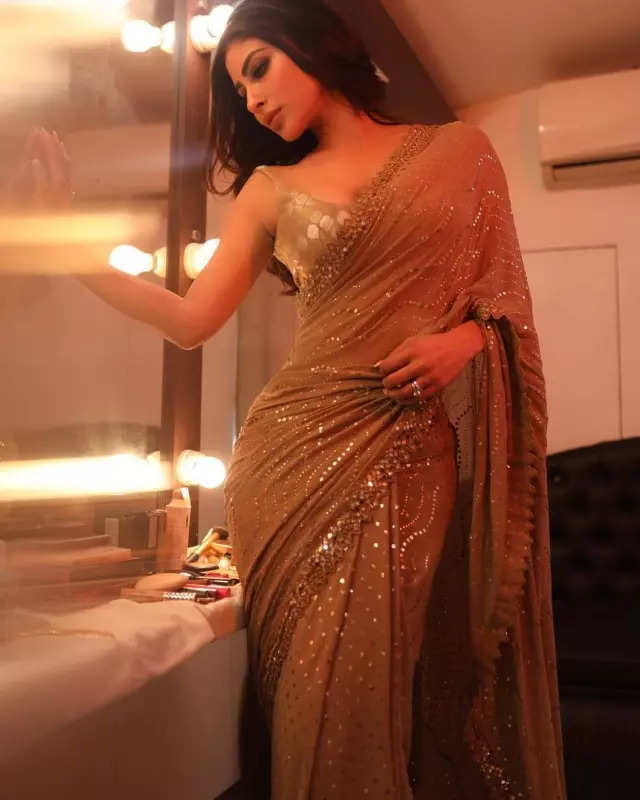 Mouni Roy's penchant for shimmery golden ensembles in stunning pictures