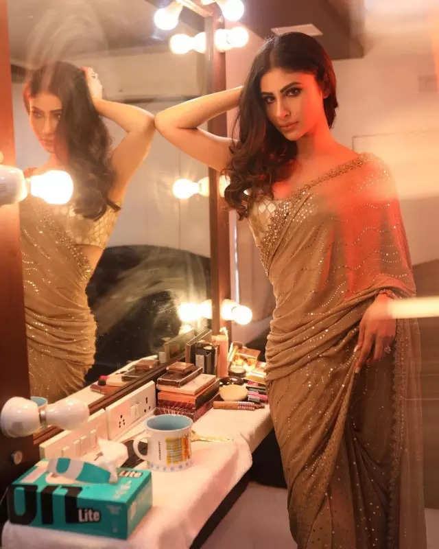 Mouni Roy's penchant for shimmery golden ensembles in stunning pictures