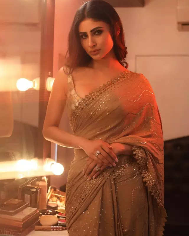 Mouni Roy's penchant for shimmery golden ensembles in stunning pictures