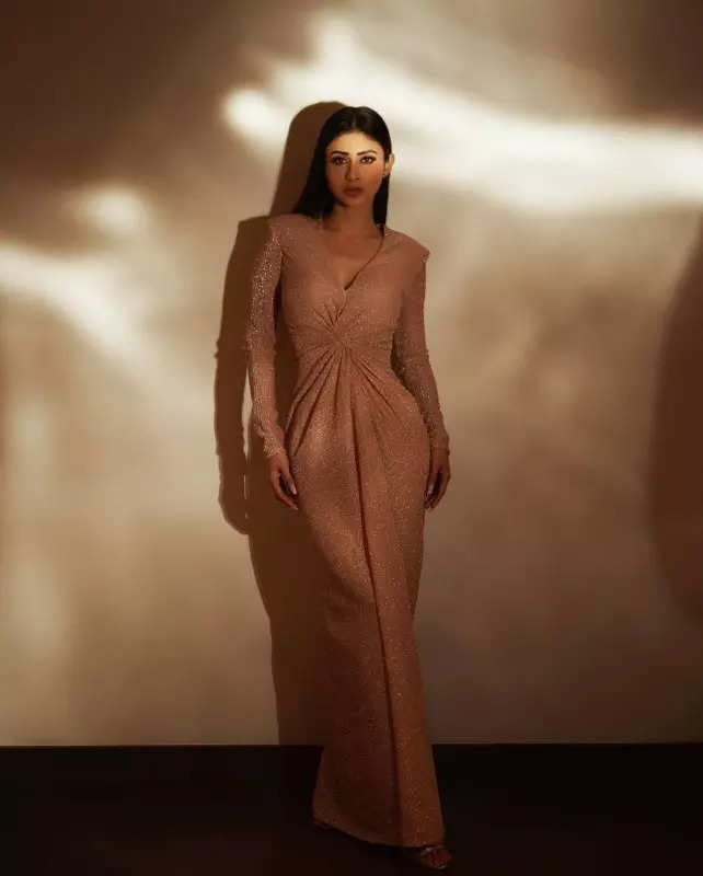 Mouni Roy's penchant for shimmery golden ensembles in stunning pictures