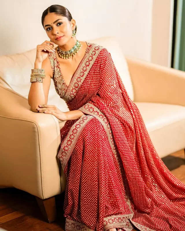 Mrunal Thakur looks radiant in a timeless red saree, sets ethnic style bar high in stunning pictures