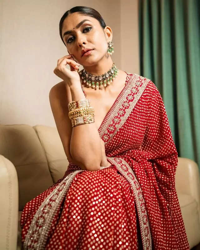Mrunal Thakur looks radiant in a timeless red saree, sets ethnic style bar high in stunning pictures