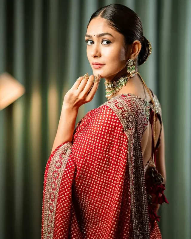 Mrunal Thakur looks radiant in a timeless red saree, sets ethnic style bar high in stunning pictures