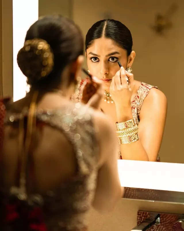 Mrunal Thakur looks radiant in a timeless red saree, sets ethnic style bar high in stunning pictures