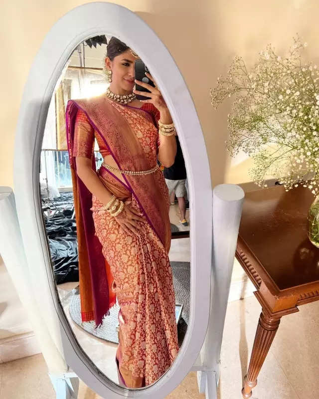 Mrunal Thakur looks radiant in a timeless red saree, sets ethnic style bar high in stunning pictures